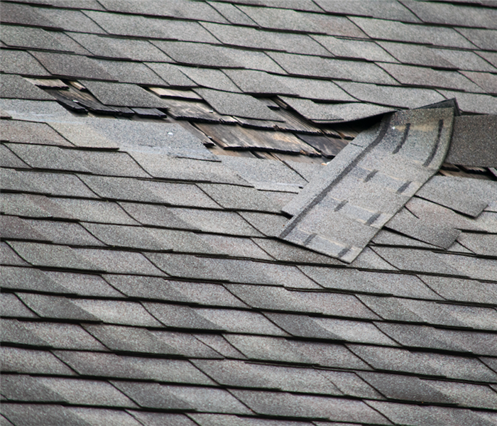 a roof with shingles out of place